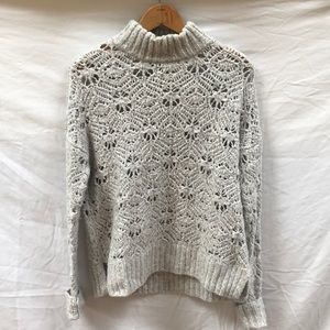 Off-white knit turtleneck sweater